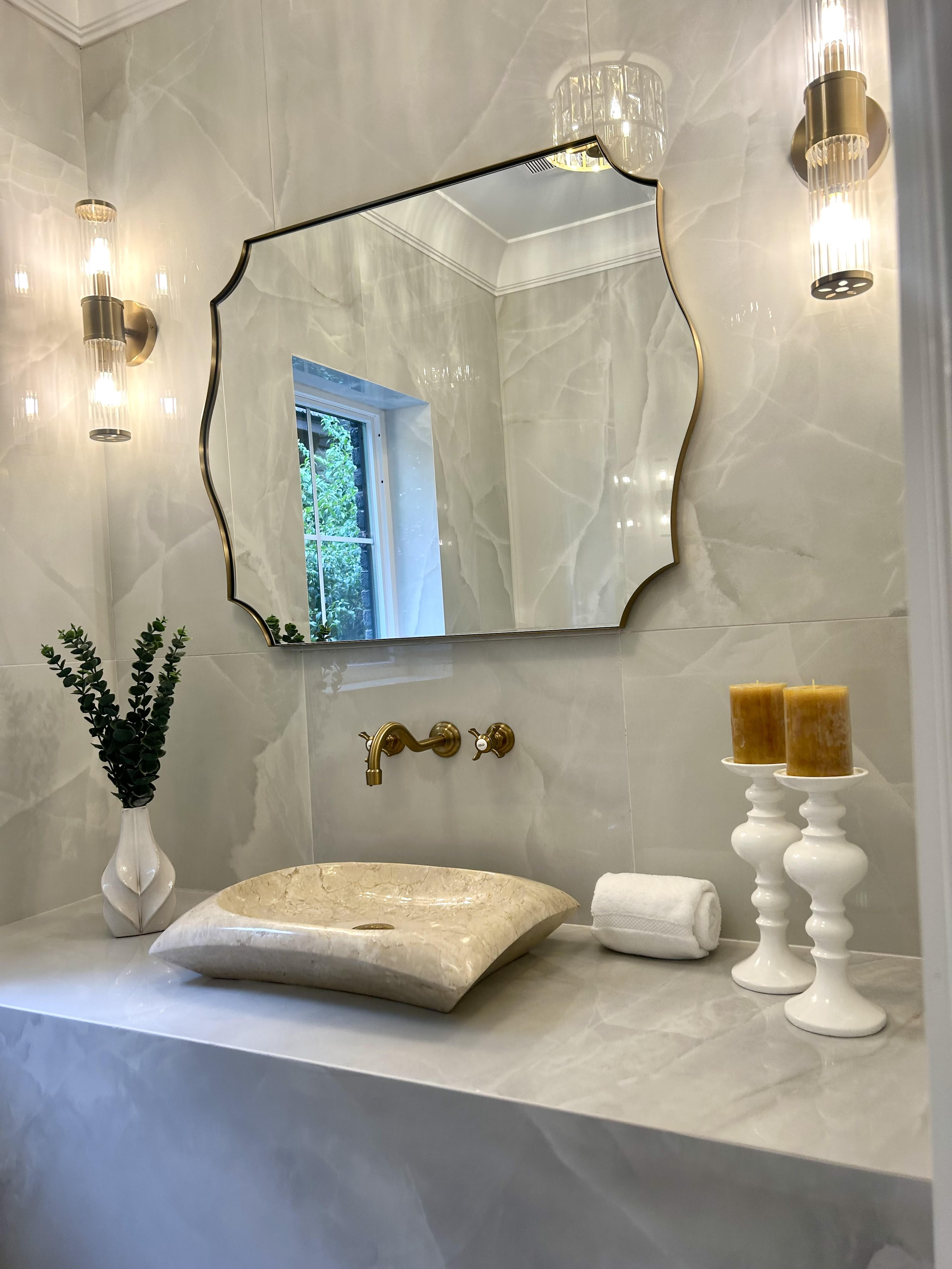 A luxurious bathroom with elegant fixtures and tasteful decor.