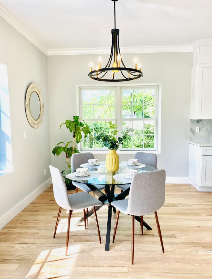 home staging of small dining area with elegant lighting for space optimization and a welcoming atmosphere