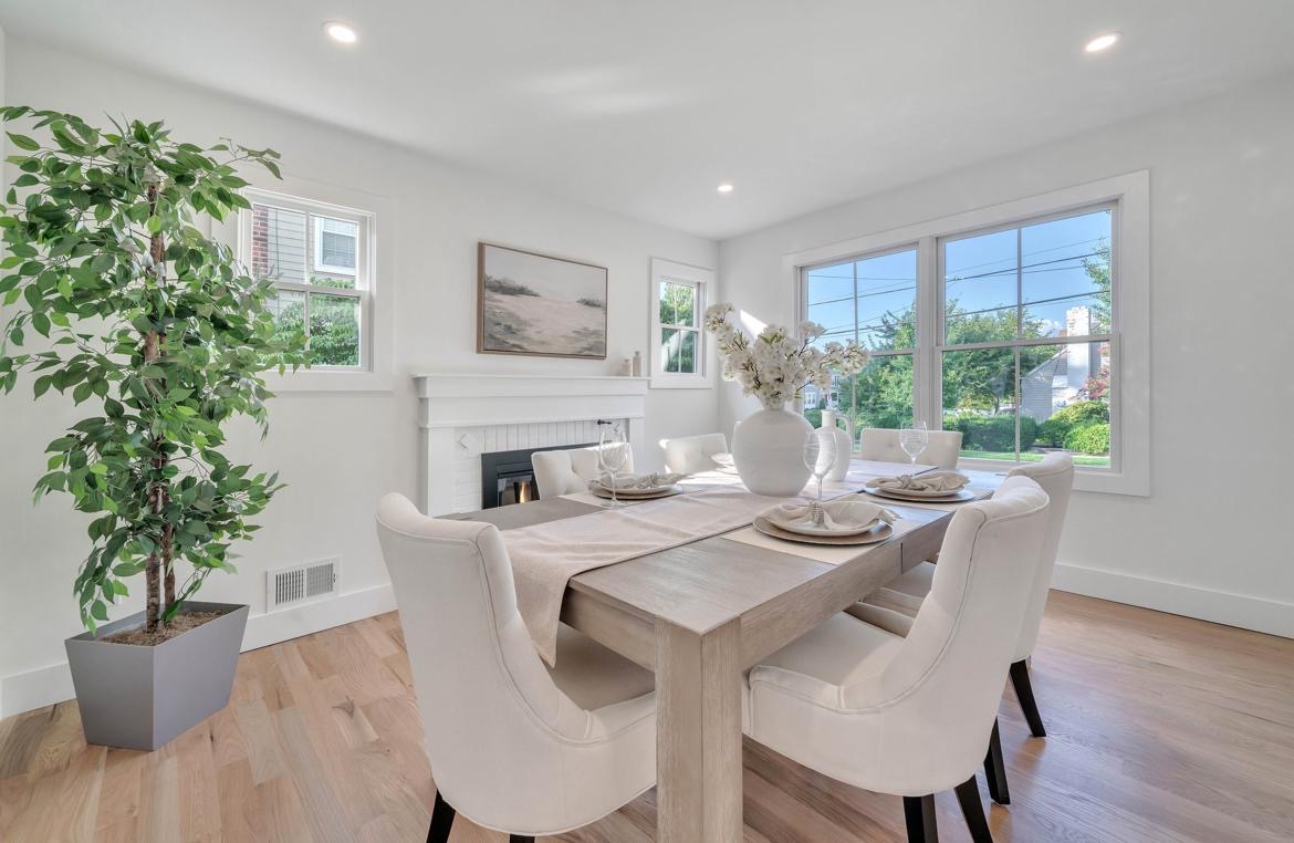 affordable staging of modern dining room with wooden table and upholstered chairs