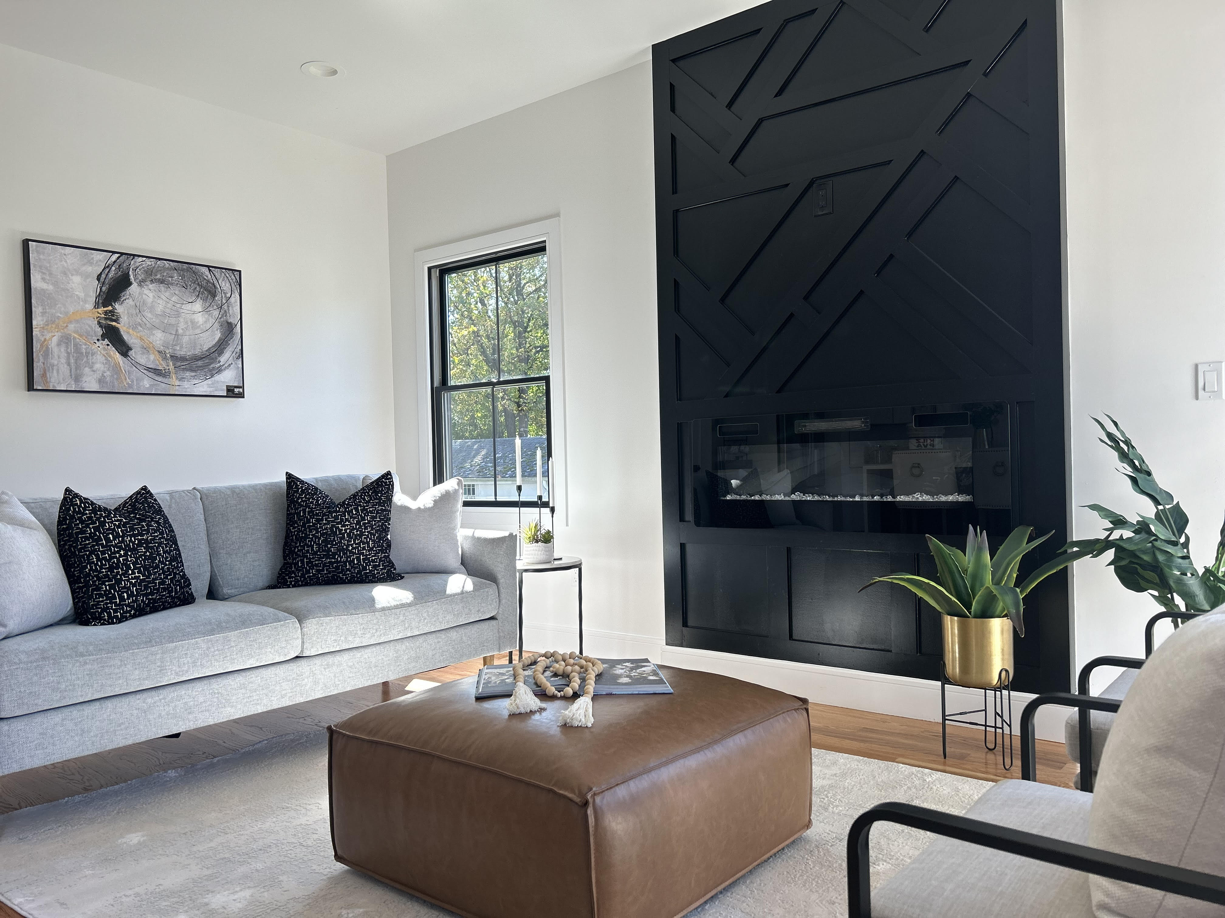 luxury staging of living room with an accent wall to complement modern look