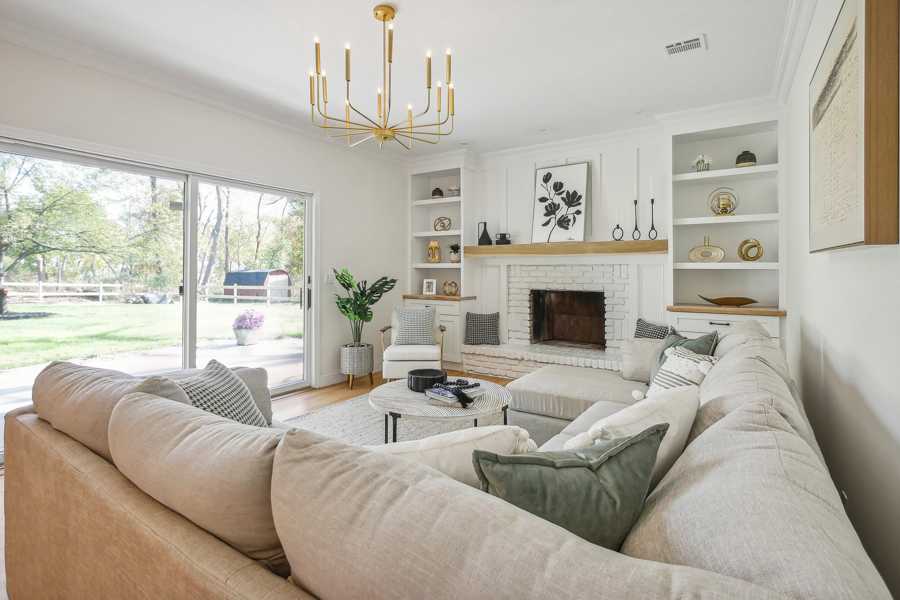 professional home stager livens up a living room with a chandelier