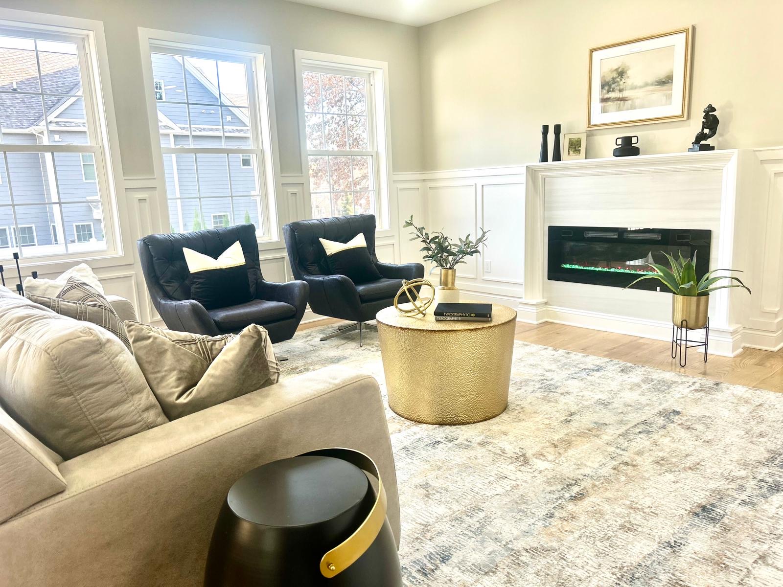 staging a house for sale with an open-concept living room featuring a complementary furniture arrangement